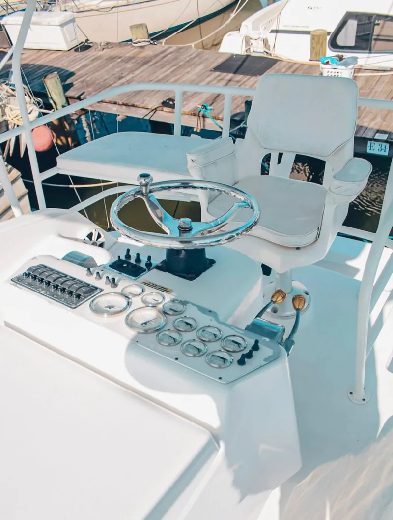 Slide: The Image of 1993 Luhrs 350 Tournament boat helm with steering wheel and control panel. - 8