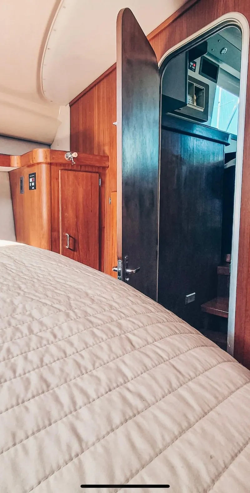 Slide: The Image of Interior of 1993 Luhrs 350 Tournament boat with wooden cabinetry and open door. - 9