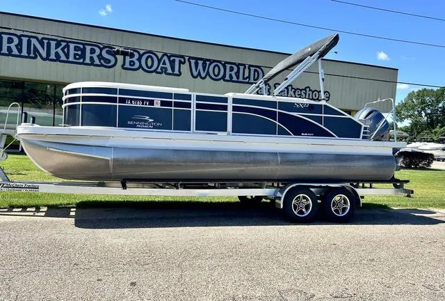 Slide: The Image of 2020 Bennington 22 SX pontoon boat on trailer at Rinker's Boat World. - 1