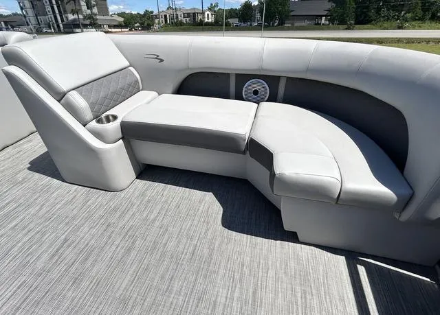 Slide: The Image of 2020 Bennington 22 SX boat interior with gray cushioned seating and cup holder. - 10