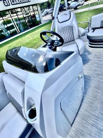 Slide: The Image of 2020 Bennington 22 SX boat interior with sleek helm and comfortable seating. - 13