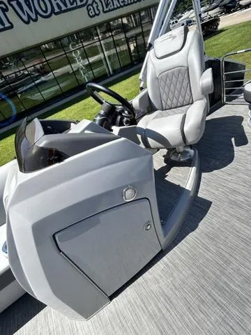 Slide: The Image of 2020 Bennington 22 SX boat interior with modern helm and comfortable seating. - 14