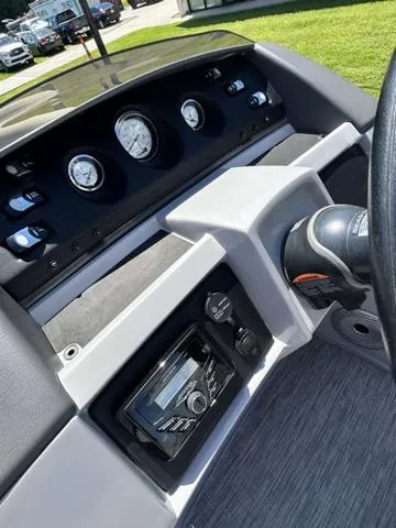 Slide: The Image of 2020 Bennington 22 SX boat dashboard with gauges and controls, featuring a modern design. - 18