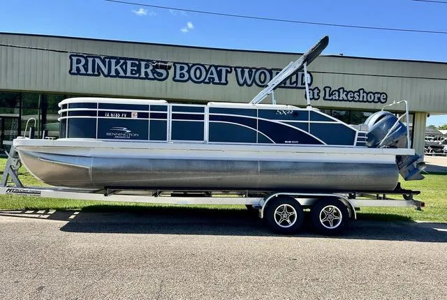 Slide: The Image of 2020 Bennington 22 SX pontoon boat on trailer at Rinker's Boat World. - 2