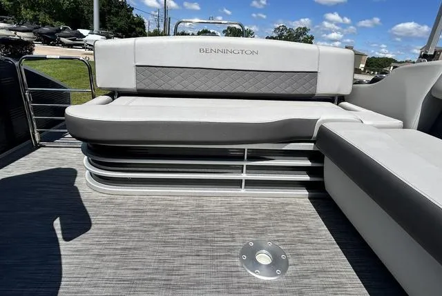 Slide: The Image of 2020 Bennington 22 SX pontoon boat seating with gray upholstery and sleek design. - 22