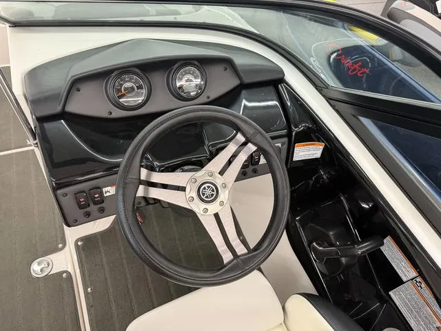 Slide: The Image of 2017 Yamaha Boats SX195 dashboard with steering wheel and gauges. - 16