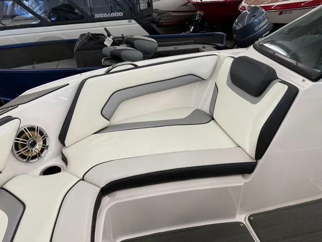 Slide: The Image of 2017 Yamaha SX195 boat interior with white and gray seating and speaker detail. - 21