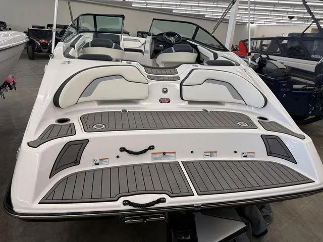 Slide: The Image of 2017 Yamaha Boats SX195, sleek white design, spacious seating, modern interior, showroom display. - 5
