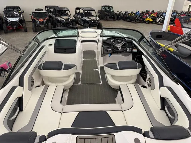 Slide: The Image of 2017 Yamaha Boats SX195 interior with sleek seating and modern dashboard, surrounded by various vehicles. - 6