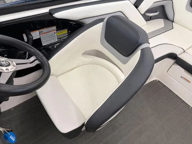 Slide: The Image of 2017 Yamaha Boats SX195 interior with steering wheel and cushioned seating. - 15
