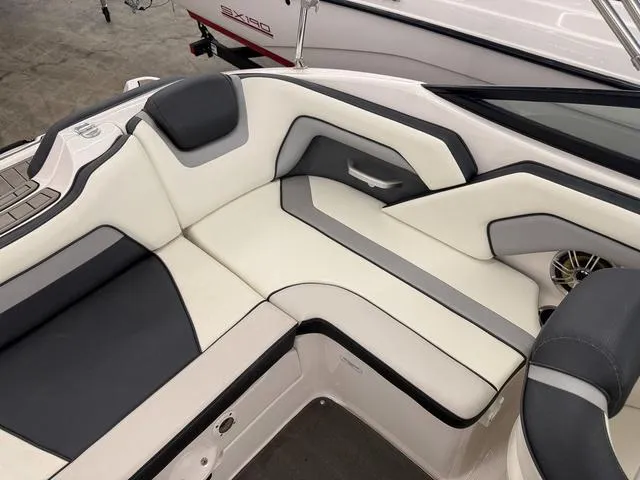 Slide: The Image of 2017 Yamaha Boats SX195 interior seating with sleek, modern design and comfortable upholstery. - 8