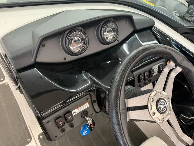Slide: The Image of 2017 Yamaha Boats SX195 dashboard with steering wheel and instrument panel. - 17