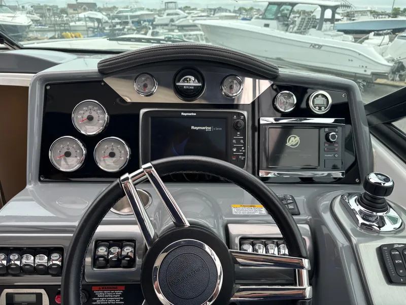 Slide: The Image of Dashboard of a 2014 Formula 350 CBR boat with gauges and navigation system. - 15