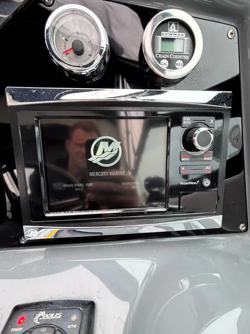Slide: The Image of Dashboard of a 2014 Formula 350 CBR boat with Mercury Marine display. - 16