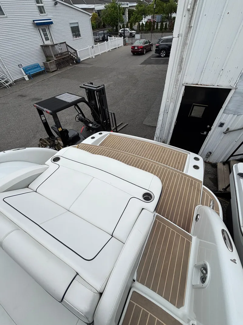 Slide: The Image of 2014 Formula 350 CBR boat with spacious deck and white seating. - 19