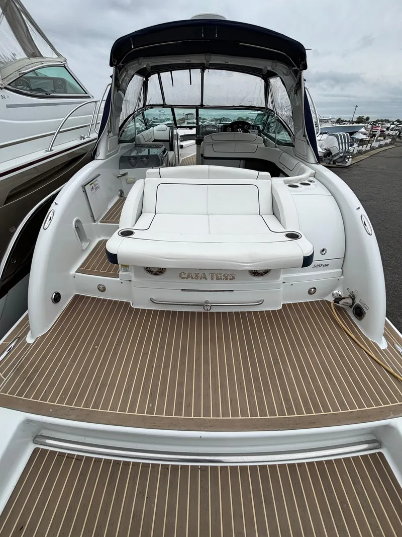 Slide: The Image of 2014 Formula 350 CBR boat with spacious deck and seating, docked at marina. - 20