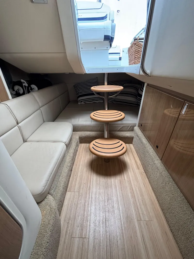 Slide: The Image of Interior of 2014 Formula 350 CBR boat with seating and wooden table. - 23