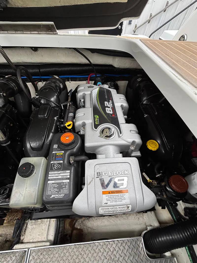 Slide: The Image of Engine compartment of a 2014 Formula 350 CBR boat, featuring a 9.0L V8 engine. - 27