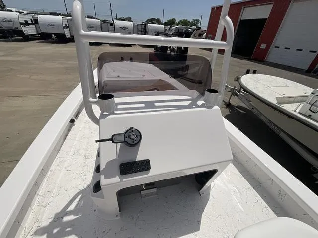 Slide: The Image of 2025 Majek 2206 Illusion boat console with steering wheel and controls, parked outdoors. - 11