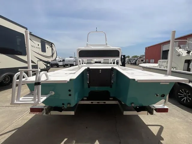 Slide: The Image of 2025 Majek 2206 Illusion boat, rear view, parked outdoors. - 4