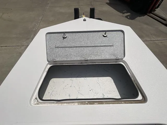 Slide: The Image of Open storage compartment on 2025 Majek 2206 Illusion boat, showing interior space. - 6