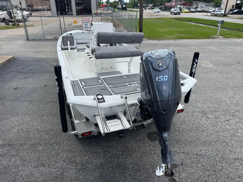 Slide: The Image of Avid 21 Fusion 2025 boat with Yamaha 150 outboard motor, parked on a trailer. - 5