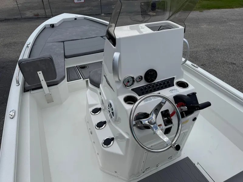 Slide: The Image of 2025 Avid 21 Fusion boat interior with steering console and seating. - 6