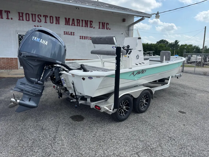 Slide: The Image of 2025 Avid 21 Fusion boat with Yamaha motor on trailer at marine dealership. - 9