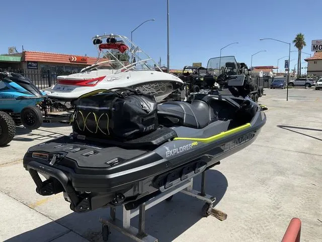 Slide: The Image of 2025 Sea-Doo Waverunner Explorer Pro on display in a sunny outdoor setting. - 4