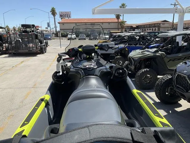 Slide: The Image of 2025 Sea-Doo Waverunner Explorer Pro parked among off-road vehicles in a dealership lot. - 6