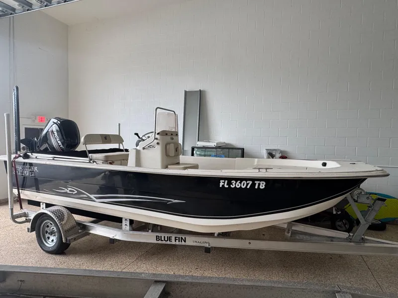 Slide: The Image of 2017 Carolina Skiff 19 LS boat on trailer in indoor storage. - 1