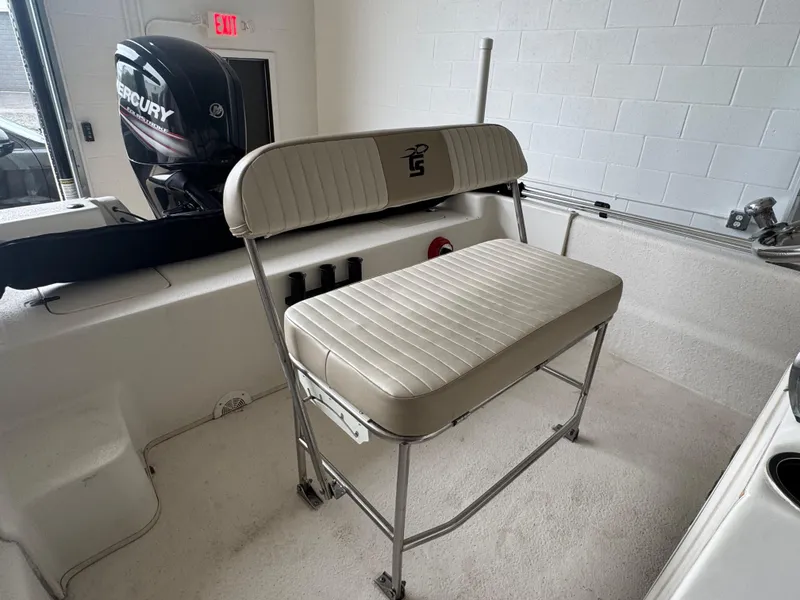 Slide: The Image of 2017 Carolina Skiff 19 LS boat interior with bench seating and Mercury outboard motor. - 10