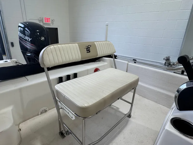 Slide: The Image of 2017 Carolina Skiff 19 LS boat interior with seating and Mercury engine. - 11