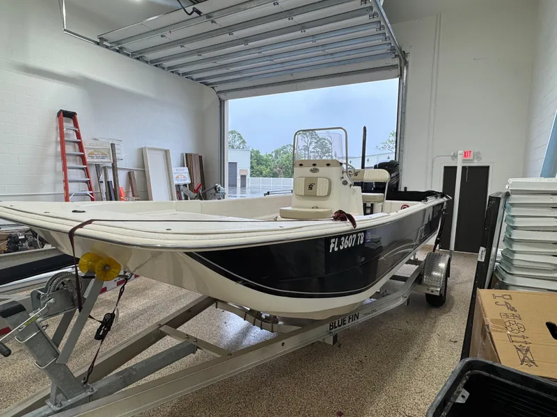 Slide: The Image of 2017 Carolina Skiff 19 LS boat on trailer in garage setting. - 3