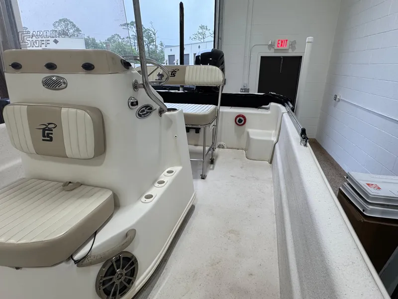 Slide: The Image of 2017 Carolina Skiff 19 LS boat interior with seating and control console. - 5