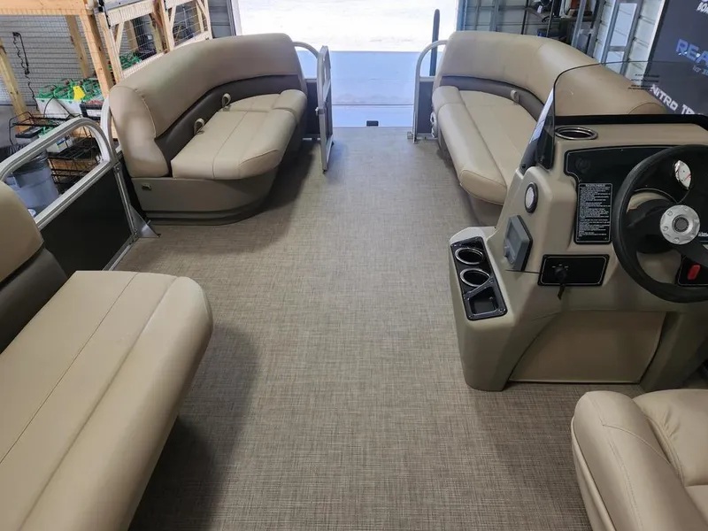 Slide: The Image of Interior of 2025 Sun Tracker PARTY BARGE® 16 DLX pontoon boat with beige seating. - 6