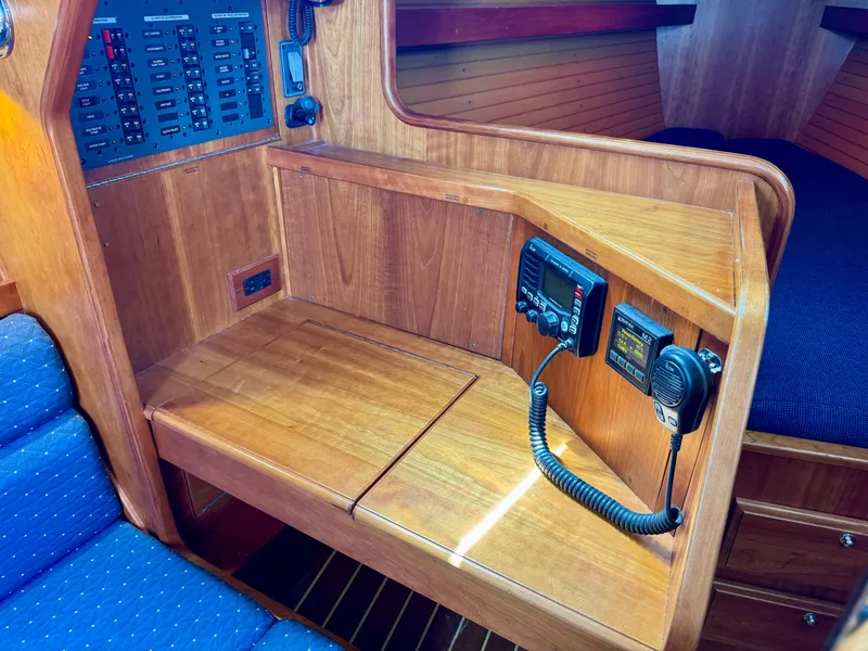 Slide: The Image of 2007 Sabre Spirit yacht interior with navigation equipment and wooden finish. - 17