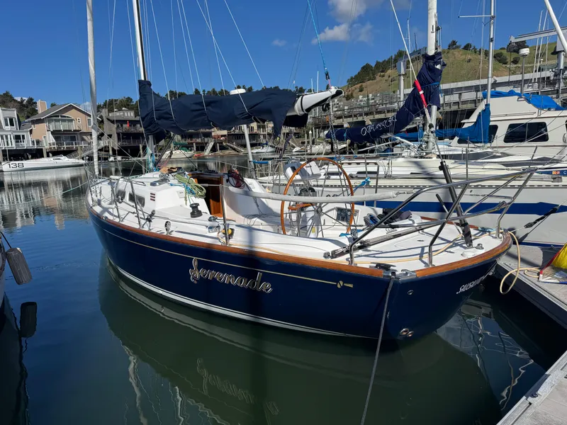 Slide: The Image of 2007 Sabre Spirit sailboat docked in a marina, surrounded by other boats. - 2