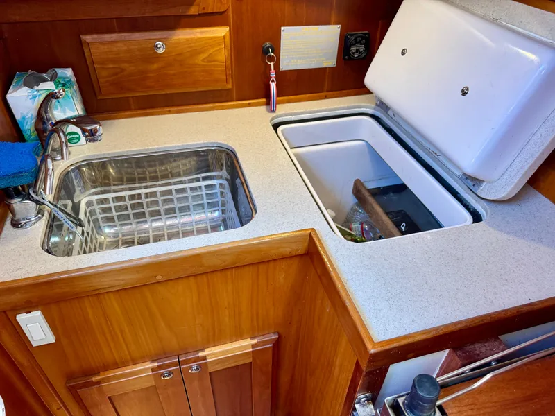 Slide: The Image of 2007 Sabre Spirit yacht kitchen with sink and storage compartments. - 22