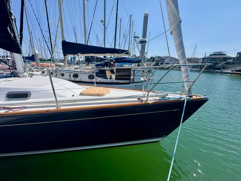Slide: The Image of 2007 Sabre Spirit sailboat docked in a marina under clear blue skies. - 24