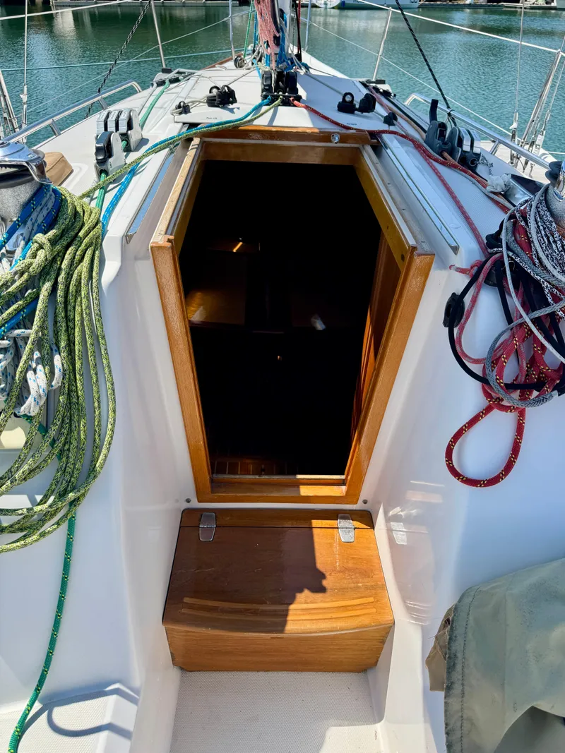 Slide: The Image of 2007 Sabre Spirit sailboat cockpit with open cabin door and colorful ropes. - 27