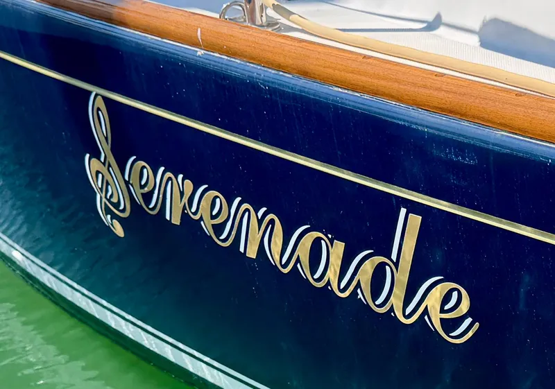 Slide: The Image of Blue Sabre Spirit 2007 boat with "Serenade" name in elegant script on the hull. - 29
