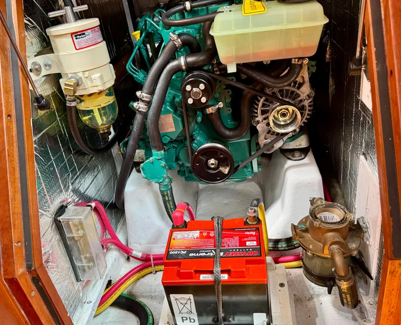 Slide: The Image of Engine compartment of a 2007 Sabre Spirit boat, featuring battery and mechanical components. - 33