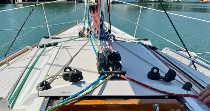 Slide: The Image of Deck view of a 2007 Sabre Spirit sailboat with colorful rigging lines. - 9