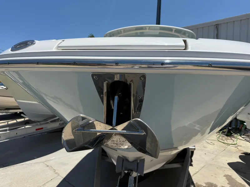 Slide: The Image of 2020 Boston Whaler 230 Vantage boat bow with anchor, docked on trailer. - 17