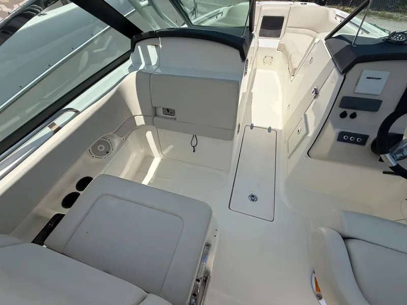 Slide: The Image of 2020 Boston Whaler 230 Vantage boat interior with seating and control panel. - 27