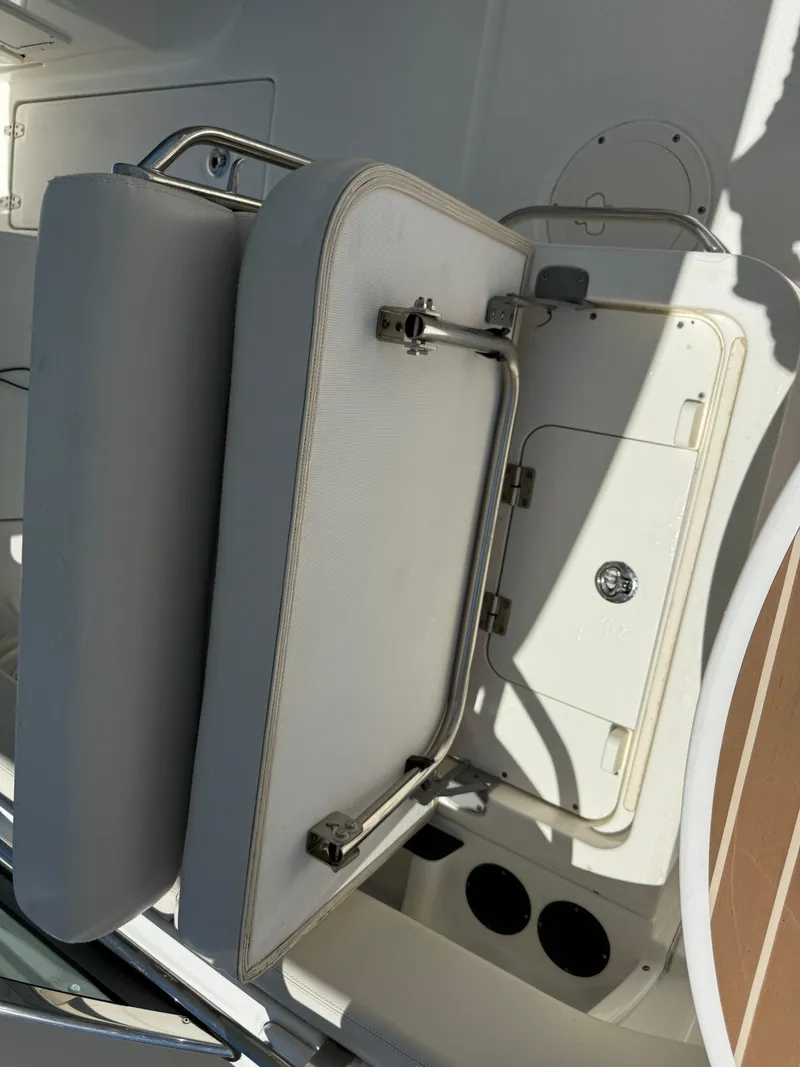 Slide: The Image of 2020 Boston Whaler 230 Vantage boat seat and storage compartment. - 42