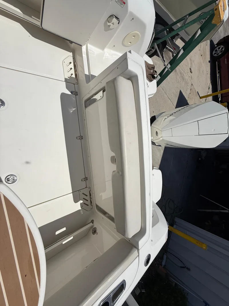 Slide: The Image of 2020 Boston Whaler 230 Vantage boat interior with seating and motor. - 43