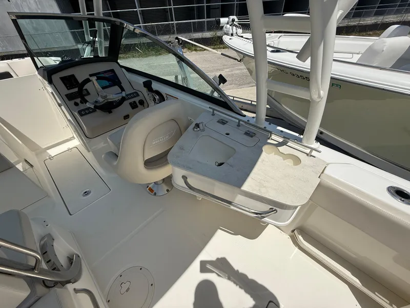 Slide: The Image of 2020 Boston Whaler 230 Vantage boat interior with helm and seating area. - 44