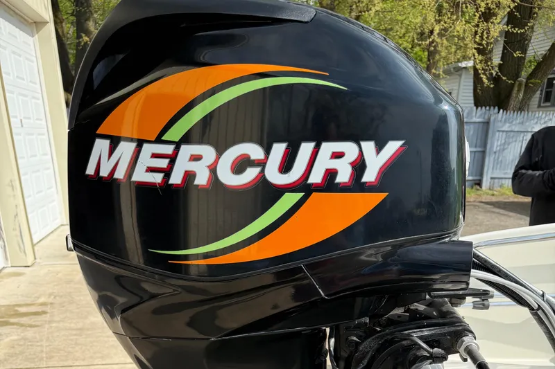 Slide: The Image of Mercury outboard motor on a 2009 Boston Whaler 130 Super Sport boat. - 15